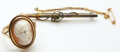 A 9ct gold ring set with a cameo (3.8g) and a 9ct gold Edwardian brooch set with a peridot and