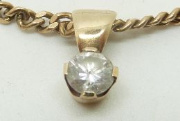 A 9ct gold pendant set with a diamond measuring approximately 0.5ct on a 9ct gold necklace, 8.6g