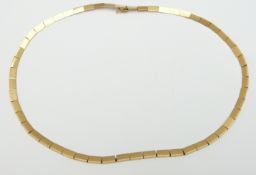 A yellow metal necklace made up of segmented rectangular links, 19.3g