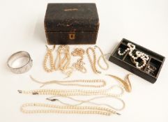 A citrine brooch, pearl necklace, silver bangle, faux pearl Trifari brooch, tooled leather box
