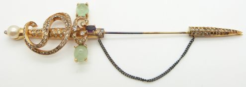 A silver gilt jabot pin set with quartz cabochons and paste