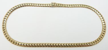 A 9ct gold necklace made up of flat curb links, 57g