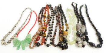 A collection of necklaces including tiger's eye, agate, dyed quartz, jasper, oynx, fluorite, etc
