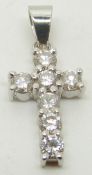 COLLECTING An 18ct white gold cross pendant set with seven diamonds each approximately 0.12ct