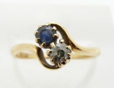 An 18ct gold ring set with a sapphire and diamond, 2.4g, size K