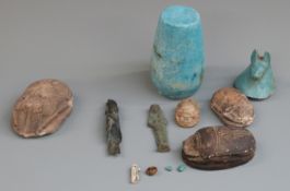 A quantity of Egyptian style artifacts including scarabs, bronzes, canopie jar