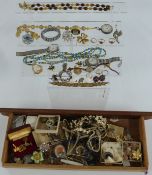 A collection of costume jewellery including 9ct gold watch back, rings, beads, watches, silver