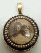 Victorian locket set with royal blue guilloché enamel and seed pearls, verso a glass compartment set