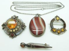 Three white metal Victorian brooches set with agate, and an agate pendant