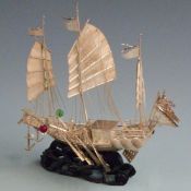 Chinese or similar Far Eastern novelty white metal model of a warship with sails, oars and figures