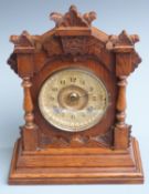 Oak cased mantel clock, the two train eight day movement by Ansonia, New York striking on a gong,