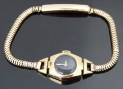 Swiss 18ct gold ladies wristwatch with gold hands, Arabic numerals, black dial and signed