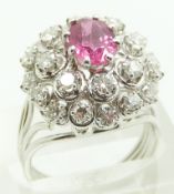 French 18ct white gold ring set with an oval ruby measuring approximately 1.3ct surrounded by