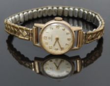 Omega 9ct gold ladies wristwatch ref. 511/5002 with gold hands and Arabic numerals, silver dial