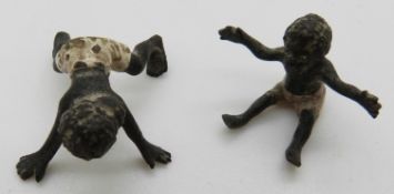 Two late 19th / early 20thC miniature cold painted bronze figures of native babies / children,