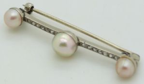 A platinum brooch set with three pearls and rose cut diamonds, length 4.5cm