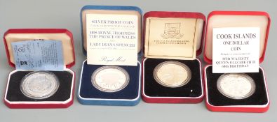 Four 1980s Royal Mint cased silver commemorative crown-sized coins to include a proof Charles and