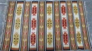 Retro 60's/70's kilim with red and yellow guls on cream ground, 310 x 196cm