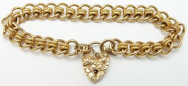 A 9ct gold curb link textured bracelet with padlock clasp, with receipt, 30g