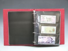Approximately 100 uncirculated overseas banknotes in a collector's album, including Nicaragua,