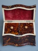 19thC two division tortoiseshell tea caddy, the serpentine fronted body on bun feet set with white