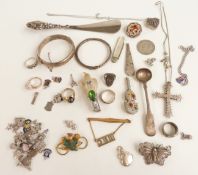 A collection of silver jewellery including bangles, fruit knife, filigree brooch, charms,
