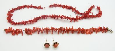 A coral necklace, bracelet and a pair of 9ct gold earrings set with coral