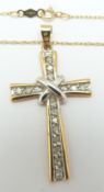 A 9ct gold cross pendant set with diamonds on a 9ct gold chain, 2.9g