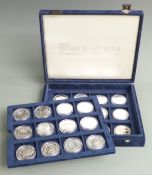 'World at War' commemorative coin set comprising mostly silver 'crown' sized coins