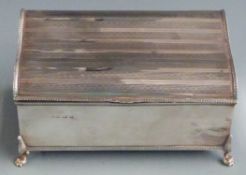 George V hallmarked silver cigarette or jewellery box with shaped engine turned lid, raised on