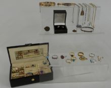 A collection of jewellery including silver necklaces, rolled gold bangles, earrings, silver rings
