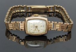 Invicta 9ct gold ladies wristwatch with gold hands and hour markers, textured silver dial, and later