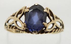 A 9ct gold ring set with an oval cut synthetic sapphire, 1.8g, size R