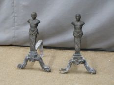 Pair of cast iron figural fire dogs