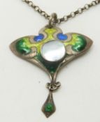 A hallmarked silver Art Nouveau pendant with green, blue and yellow enamel and a central pearl (