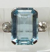 Art Deco platinum ring set with an emerald cut aquamarine measuring approximately 8.7ct and two