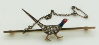 A gold brooch in the form of a pheasant set with rose cut diamonds and enamel, 5.5cm