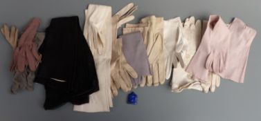 A collection of vintage kid leather and other evening gloves including full length examples together