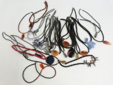 Eight agate necklaces and 15 oynx and hematite necklaces with multi coloured pendants