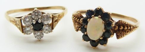 A 9ct gold ring set with an opal cabochon and sapphires and a 9ct gold ring set with a sapphire
