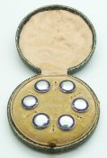A set of six hallmarked Edwardian silver buttons set with blue enamel in original box, Birmingham