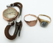A 9ct rose gold watch and two 9ct gold rings (7g)
