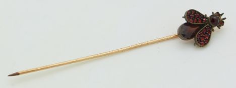Victorian stick pin in the form of a fly set with Bohemian rose cut garnets