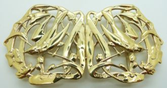 A silver gilt buckle with swallow decoration