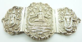 Indian white metal three piece buckle with central scene of a god atop a mythical creature, marked