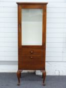 A mahogany display cabinet with glazed door, drawer and drop front compartment, on cabriole legs