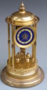 German brass anniversary clock with six reeded columns, blue enamelled dial and contrasting white