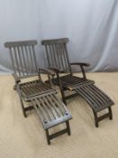 Two reclining steamer or similar garden chairs