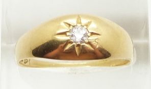 Victorian/ Edwardian 18ct gold ring set with a diamond in a star setting, 4.8g, size S