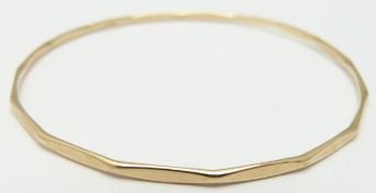 A 9ct gold bangle, 6.6g